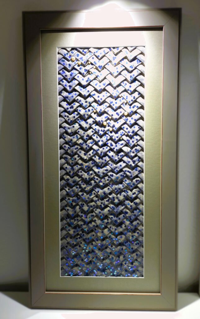 Broderie main représentant des écailles de sirène